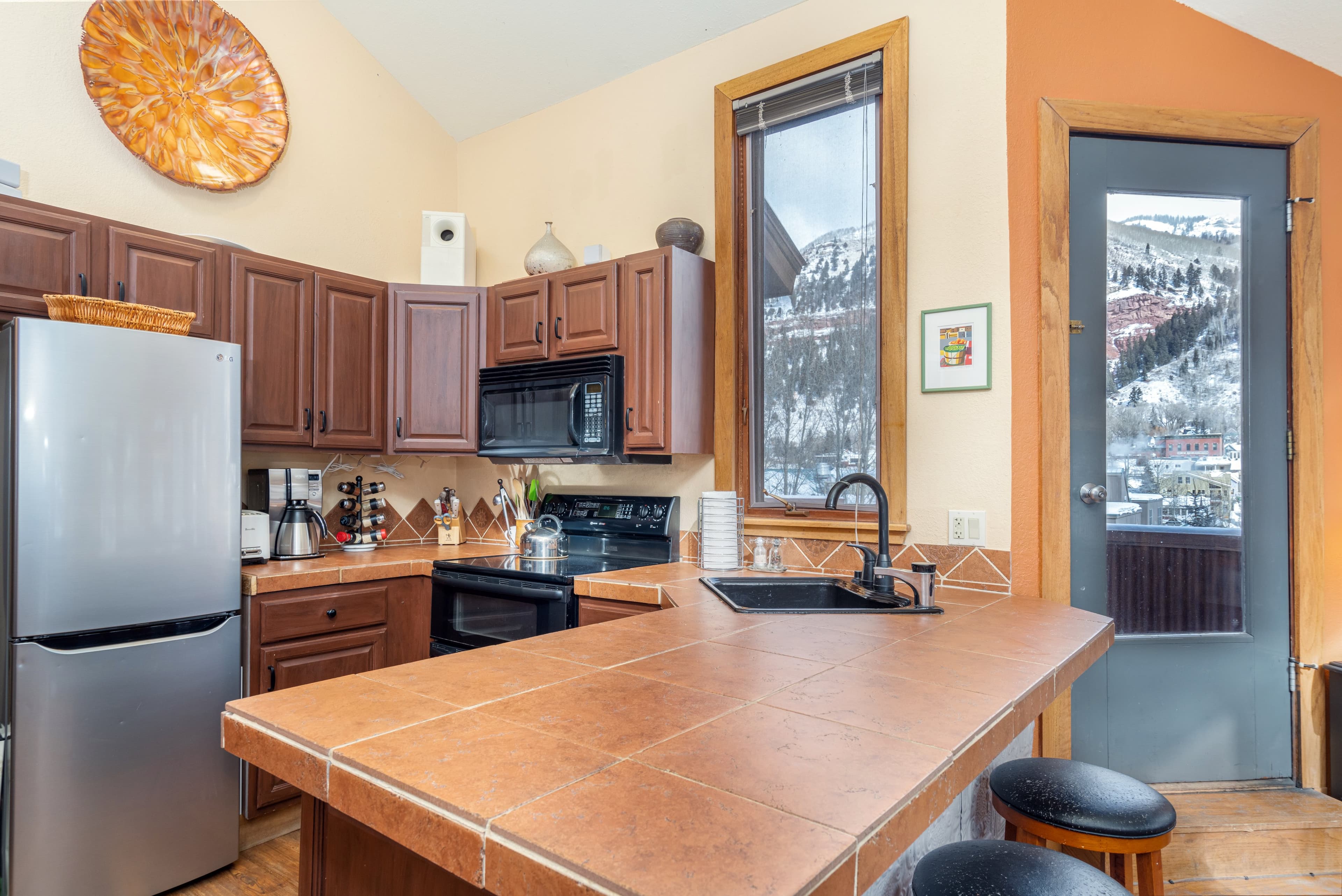 Kitchen with a refrigerator, an oven and sink