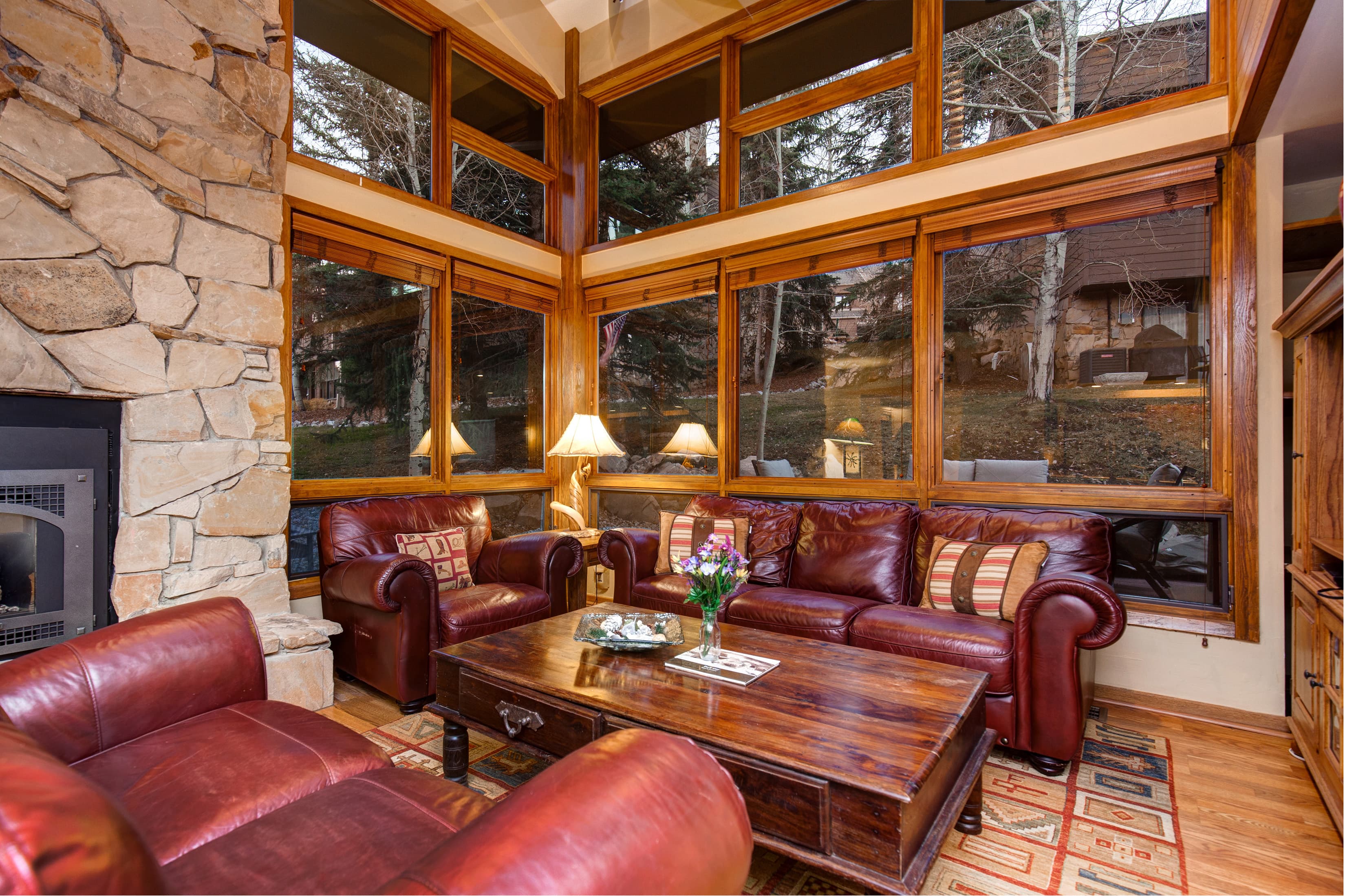Spacious living area with stone fireplace