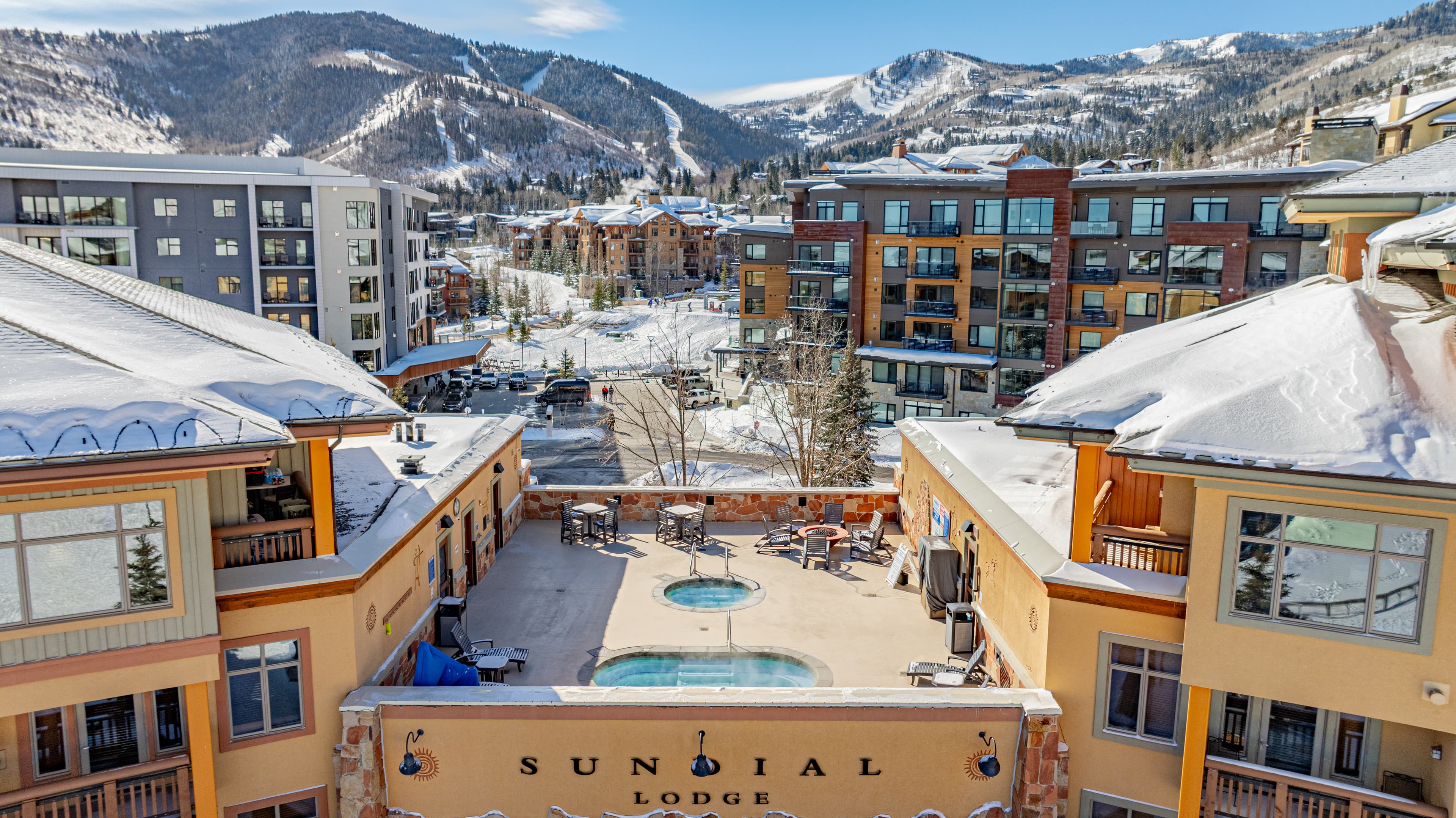 Rooftop featuring a hot tub, cold plunge and fire pit