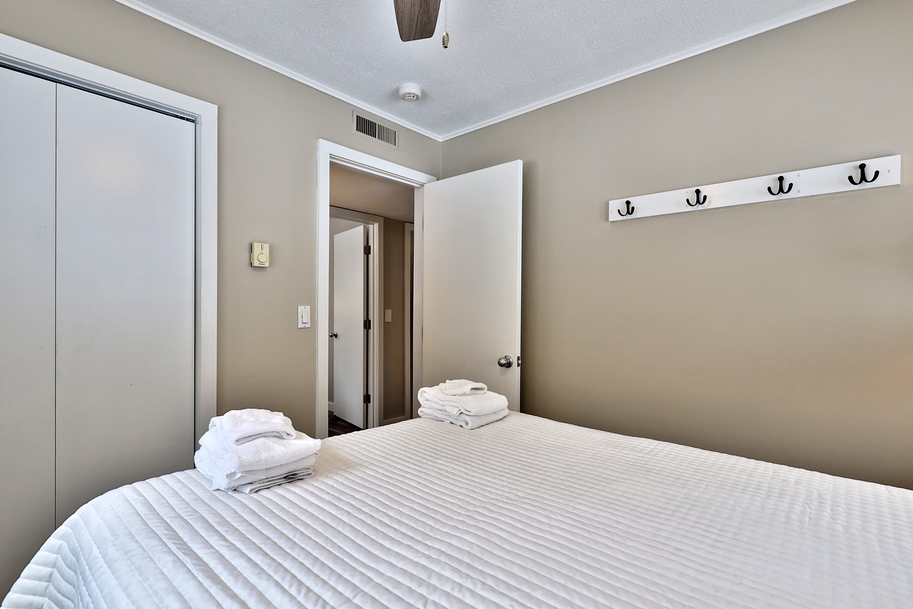 Queen bedroom.  Hooks and a closet provides plenty of storage space.