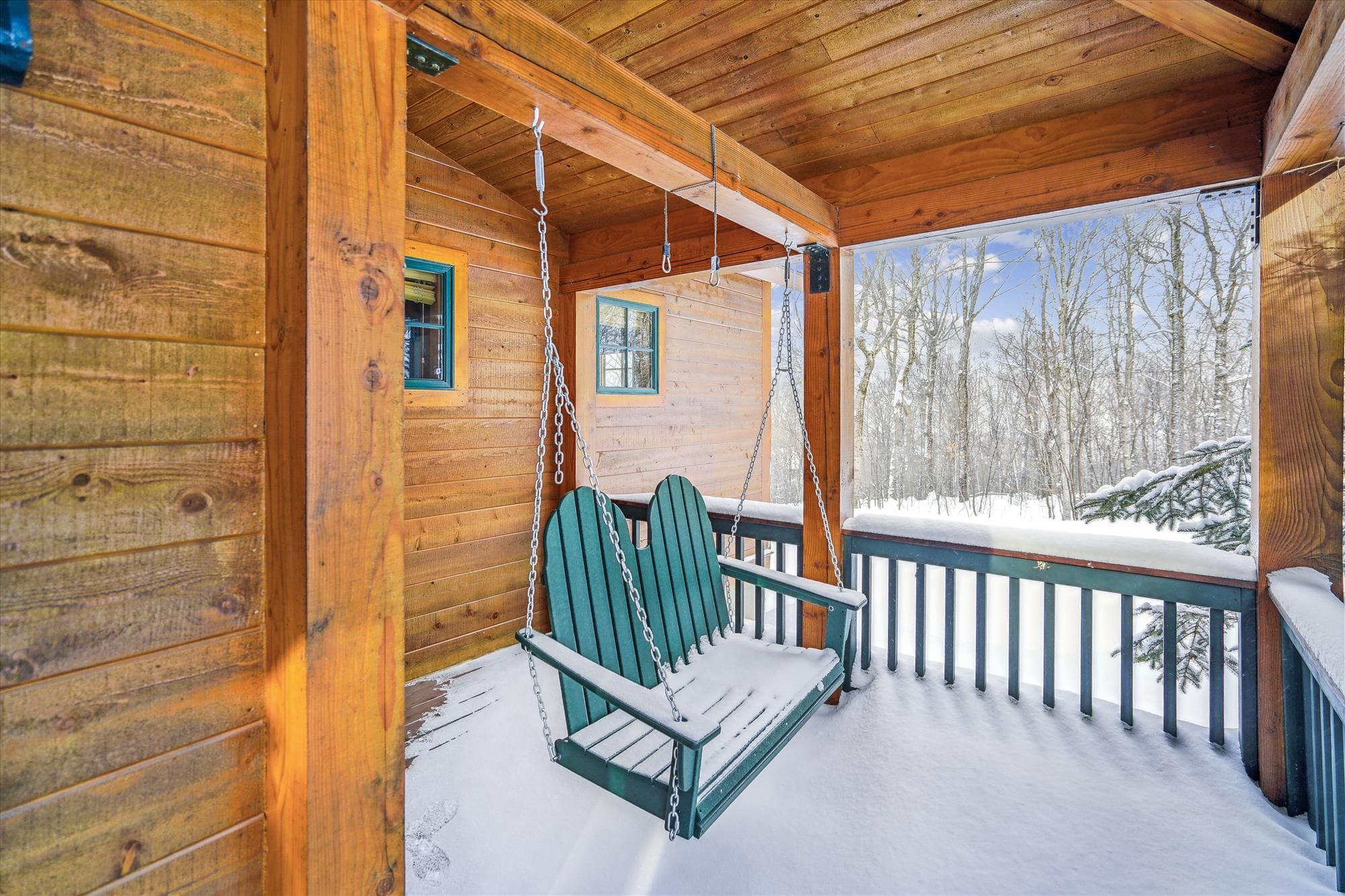 In the warmer weather, enjoy sitting on the swing.