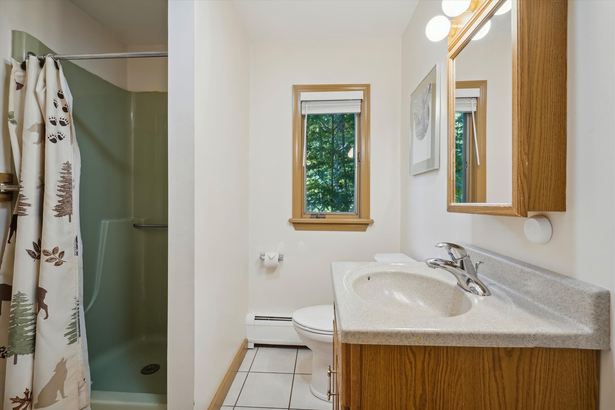 Full bathroom with only a shower.