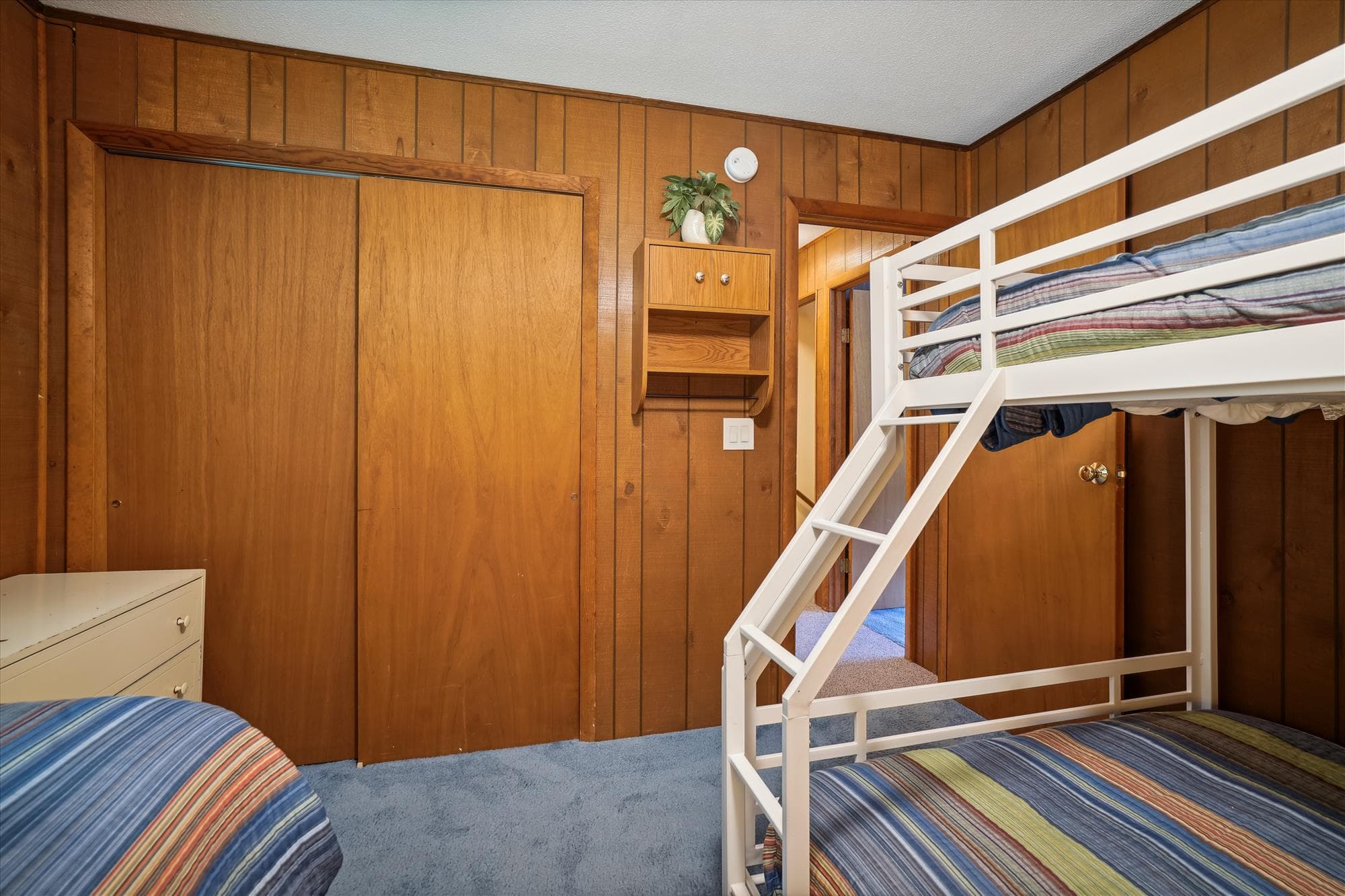 The bunk bed has a full on the bottom and a twin on top.
There is an additional twin bed in this room.