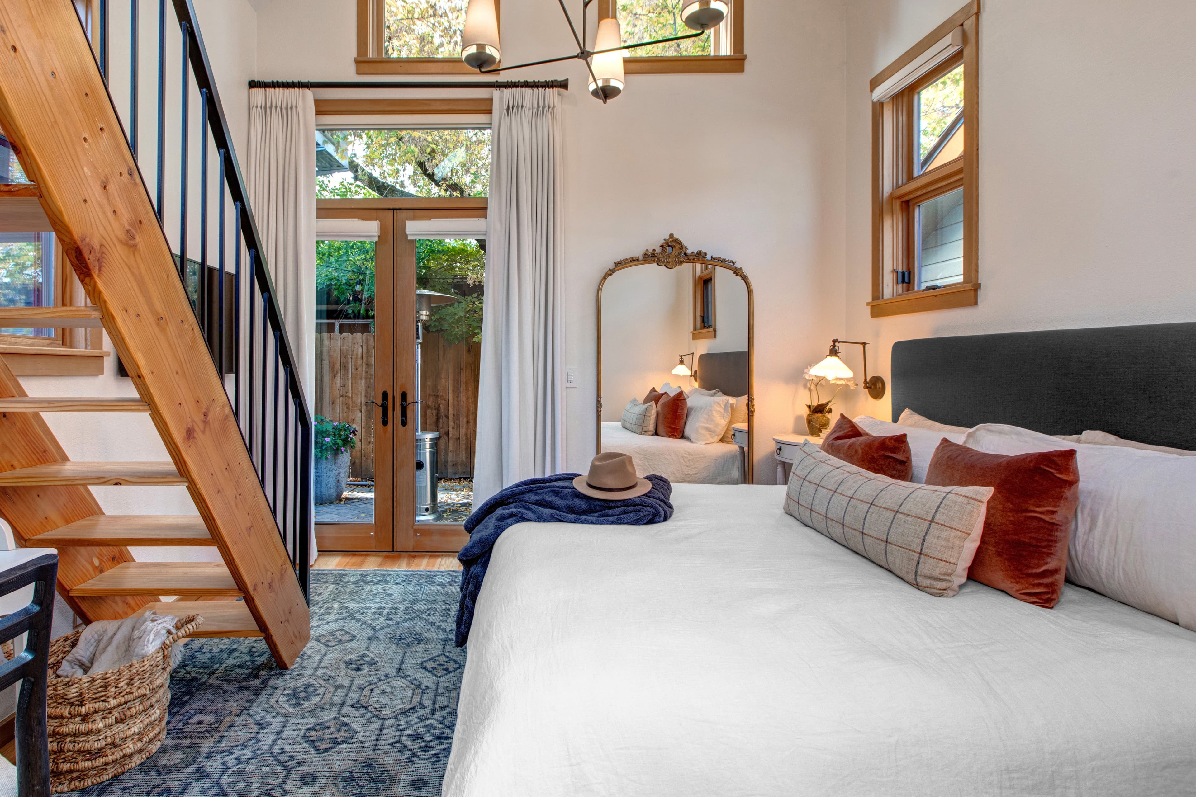 Master king bedroom, with ensuite bathroom and vaulted ceilings with a ladder up to an open loft with two additional twin beds.