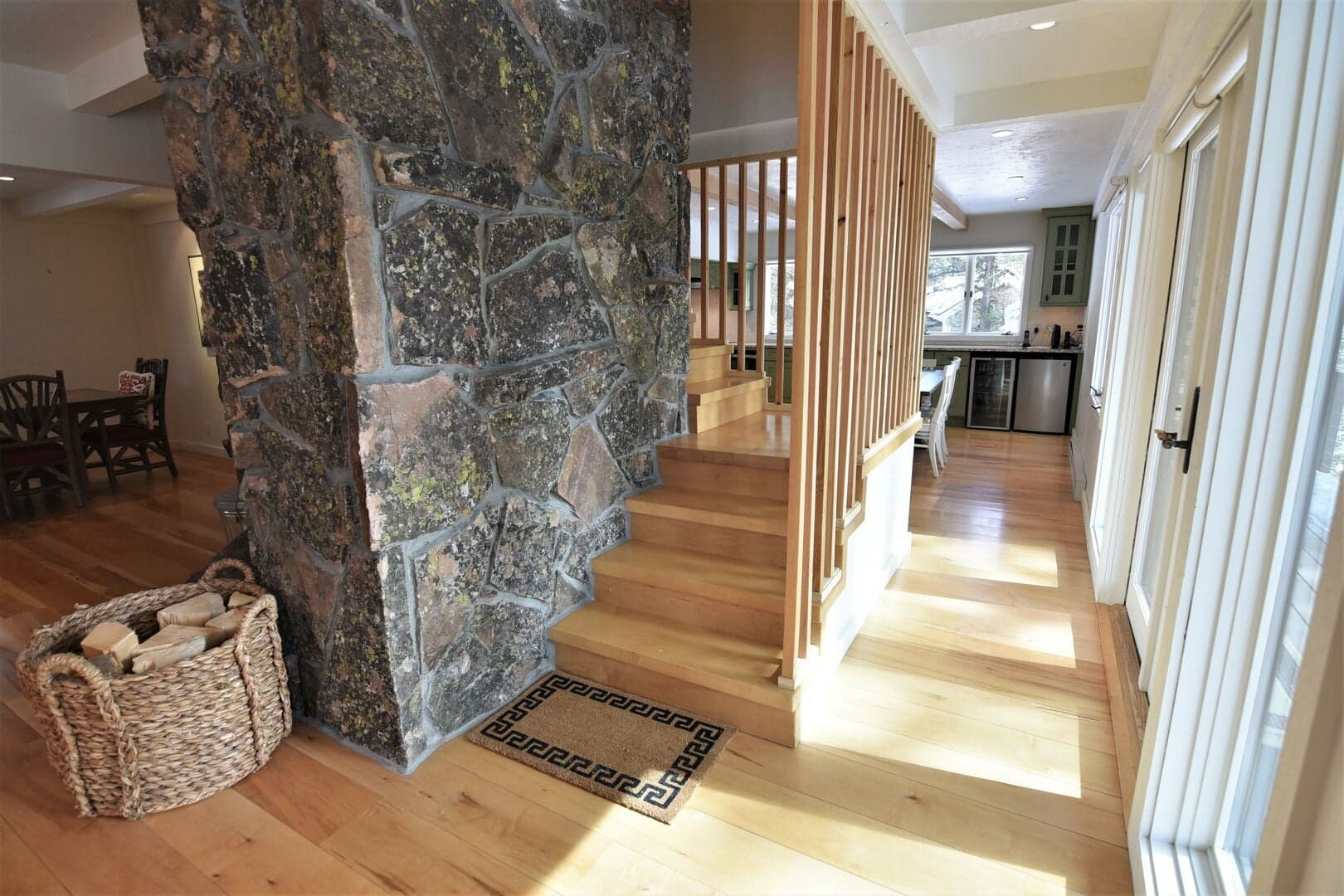 Walkway from Kitchen--Sun Room to the Right, Lounge Area to the Left