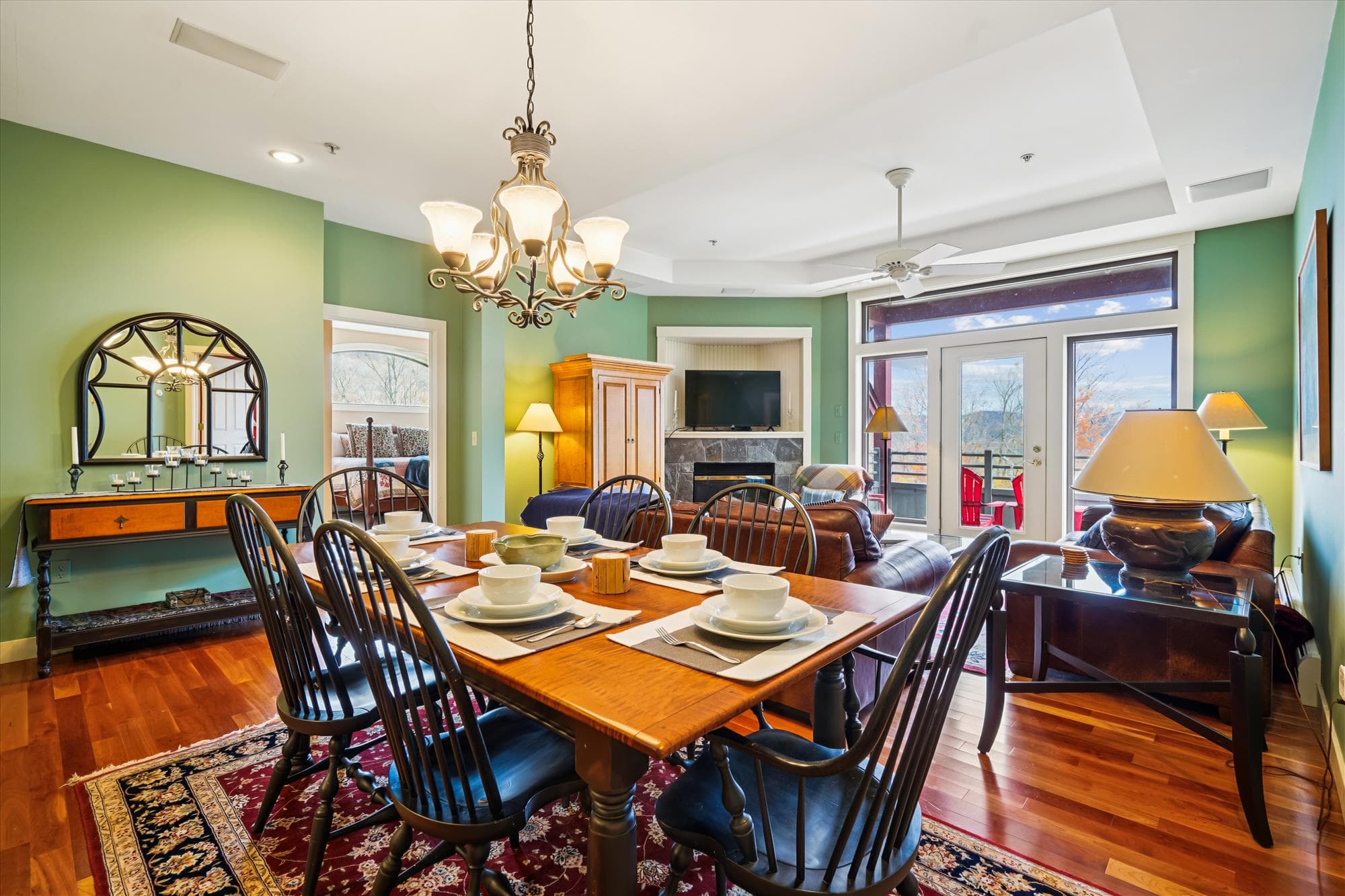 Easy flow and beautiful natural light. A solid wood table seats six comfortably, framed by mountain views.
