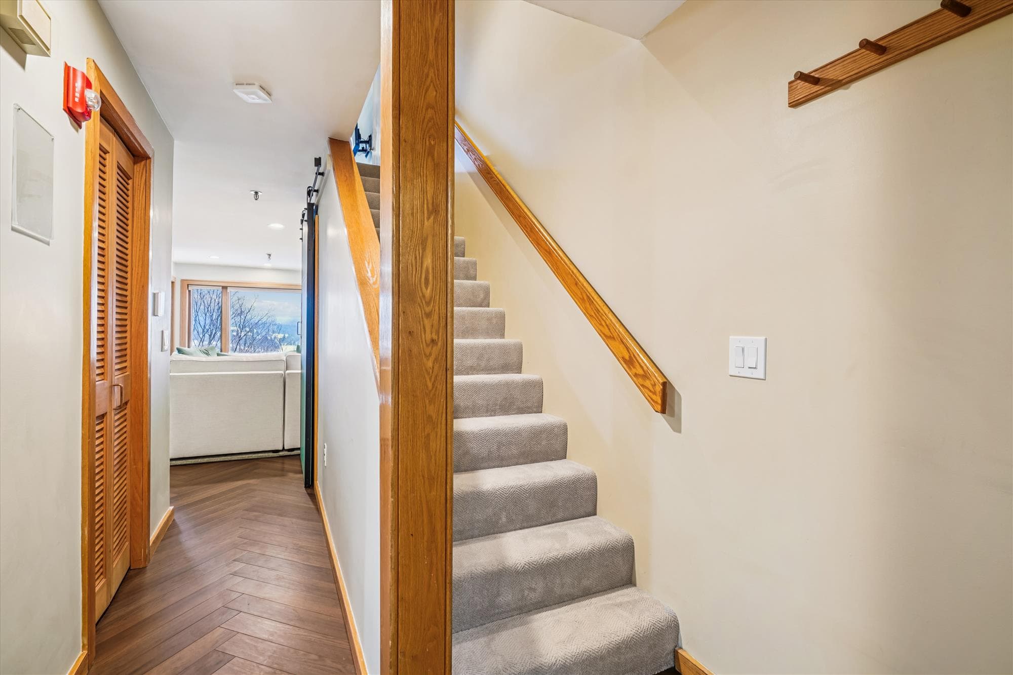 Staircase leading to the upper level where additional sleeping spaces are located.