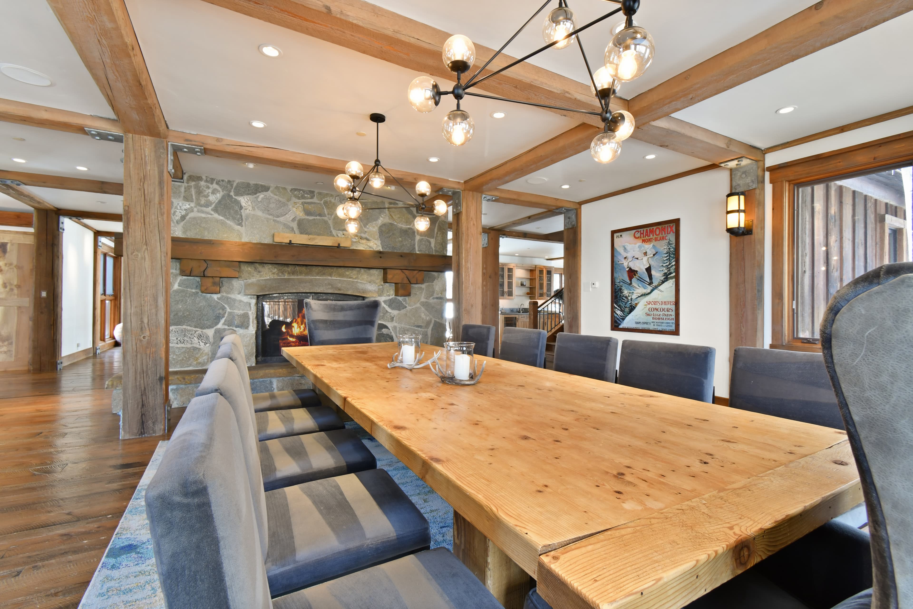 Talus Ridge's meeting/business space, with a long wooden table in the center surrounded by cushioned chairs.