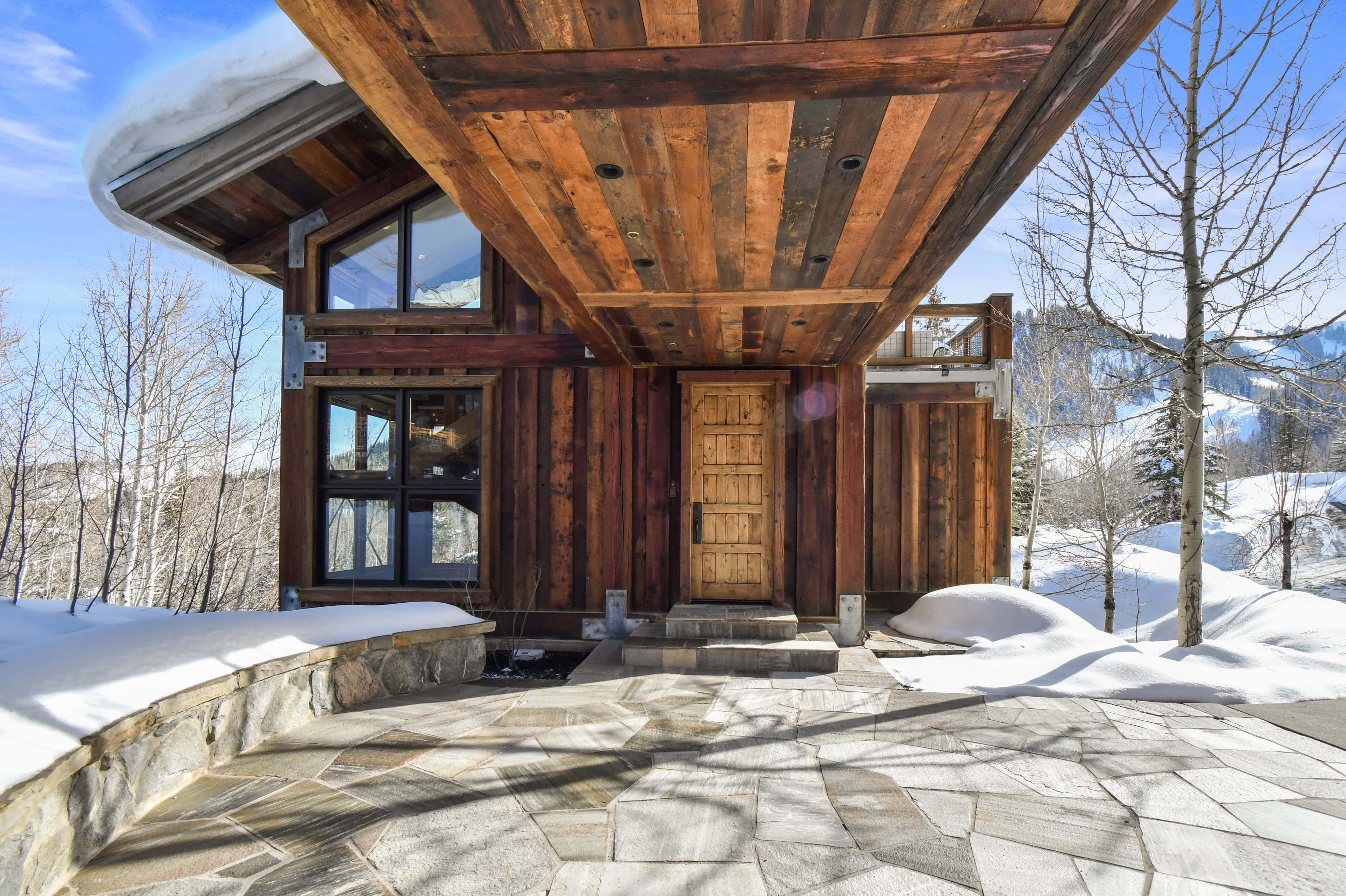 A view of the door leading into the west wing of this home, below the elevated hallway.