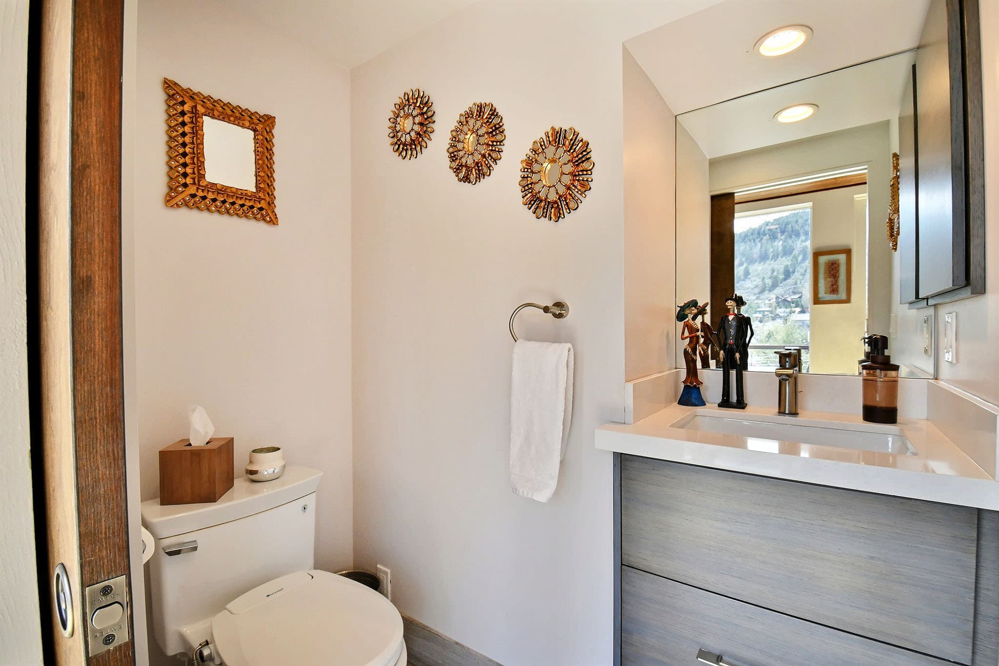 Faucet, Towel, Toilet, Vanity inside Main Street Retreat