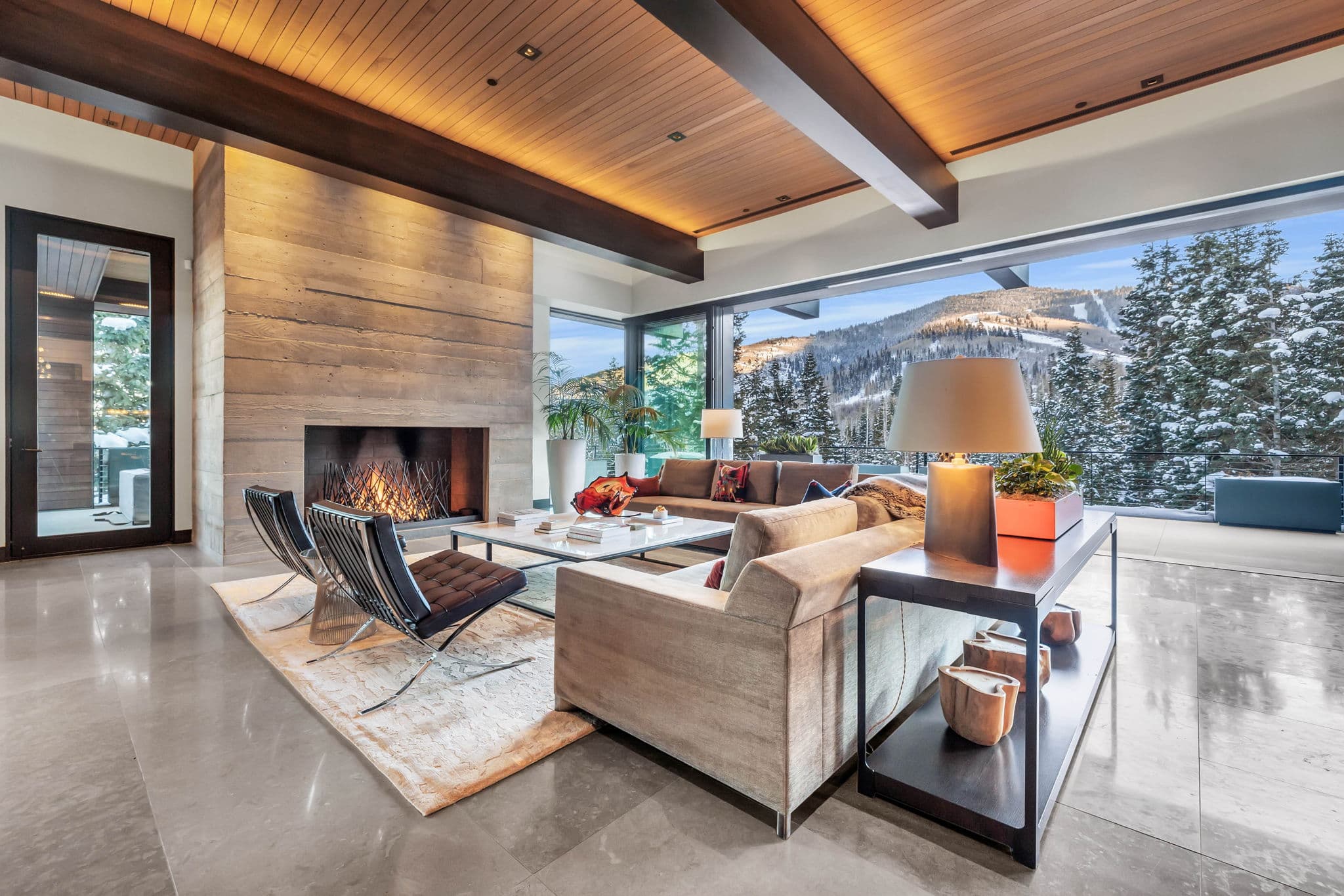 A cozy patio with a fireplace and mountain views.