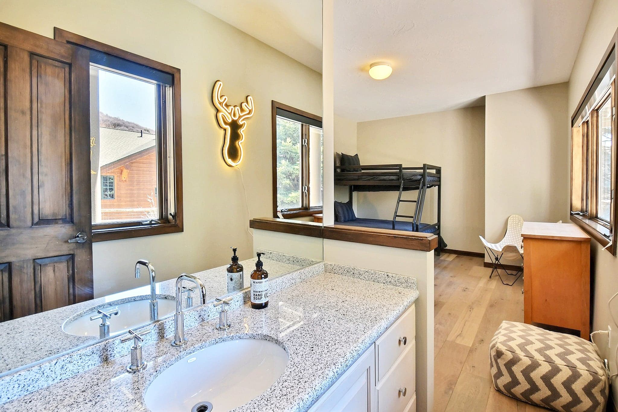 Bedroom Featuring Bunk Bed and Vanity.