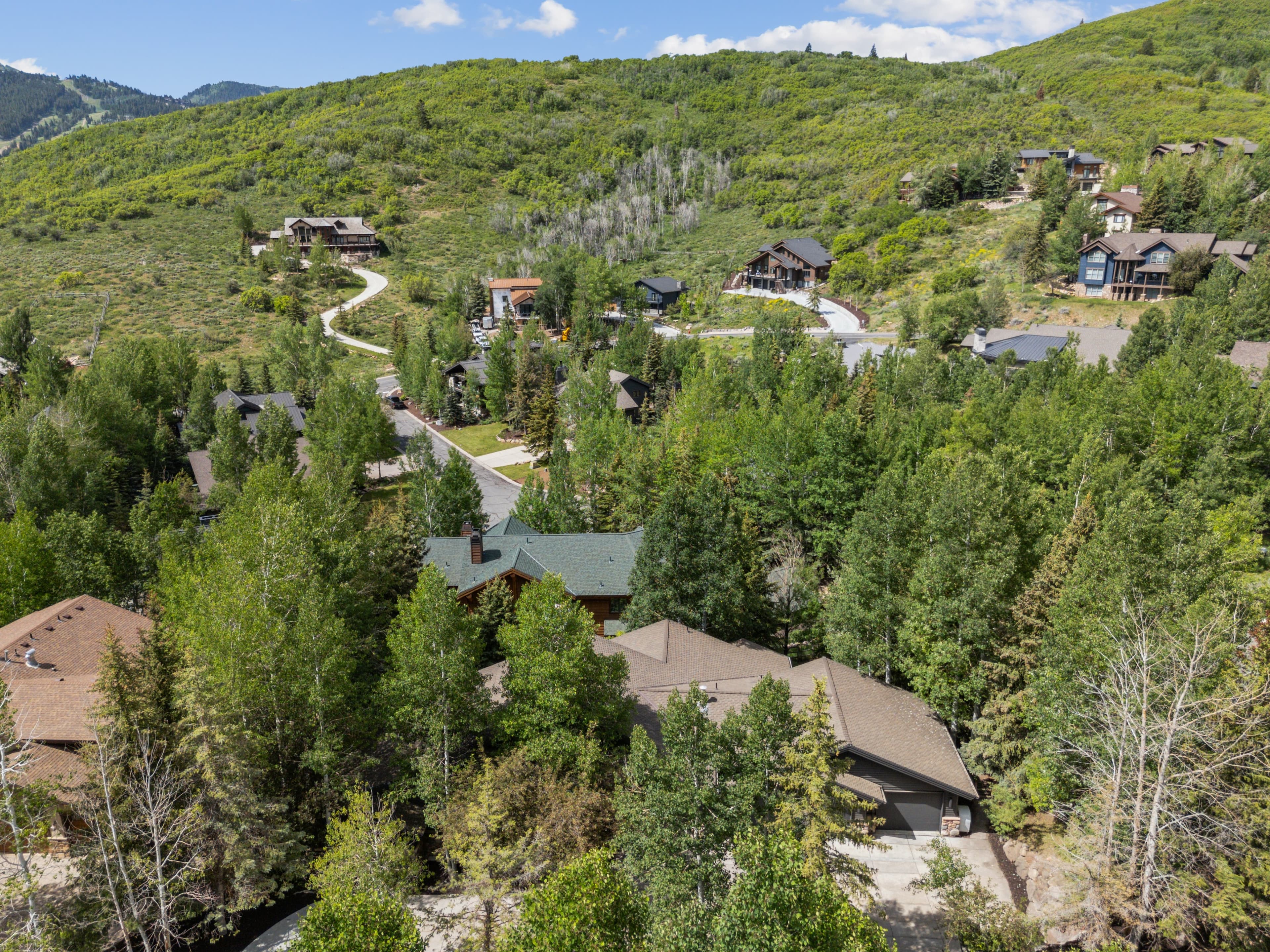 a view of deer valley bliss and the mountains behind it