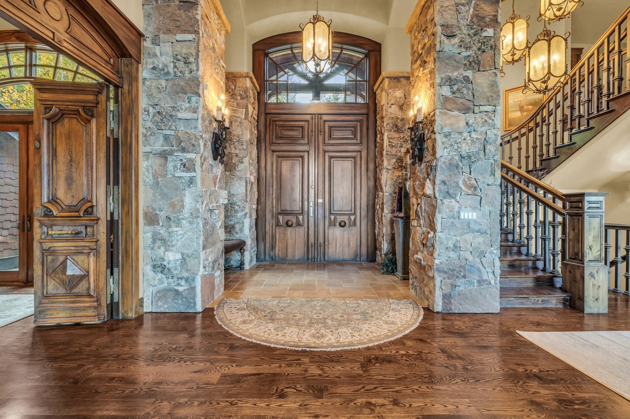 Morning Star entrance with double door, staircase, and beautiful hanging lights.