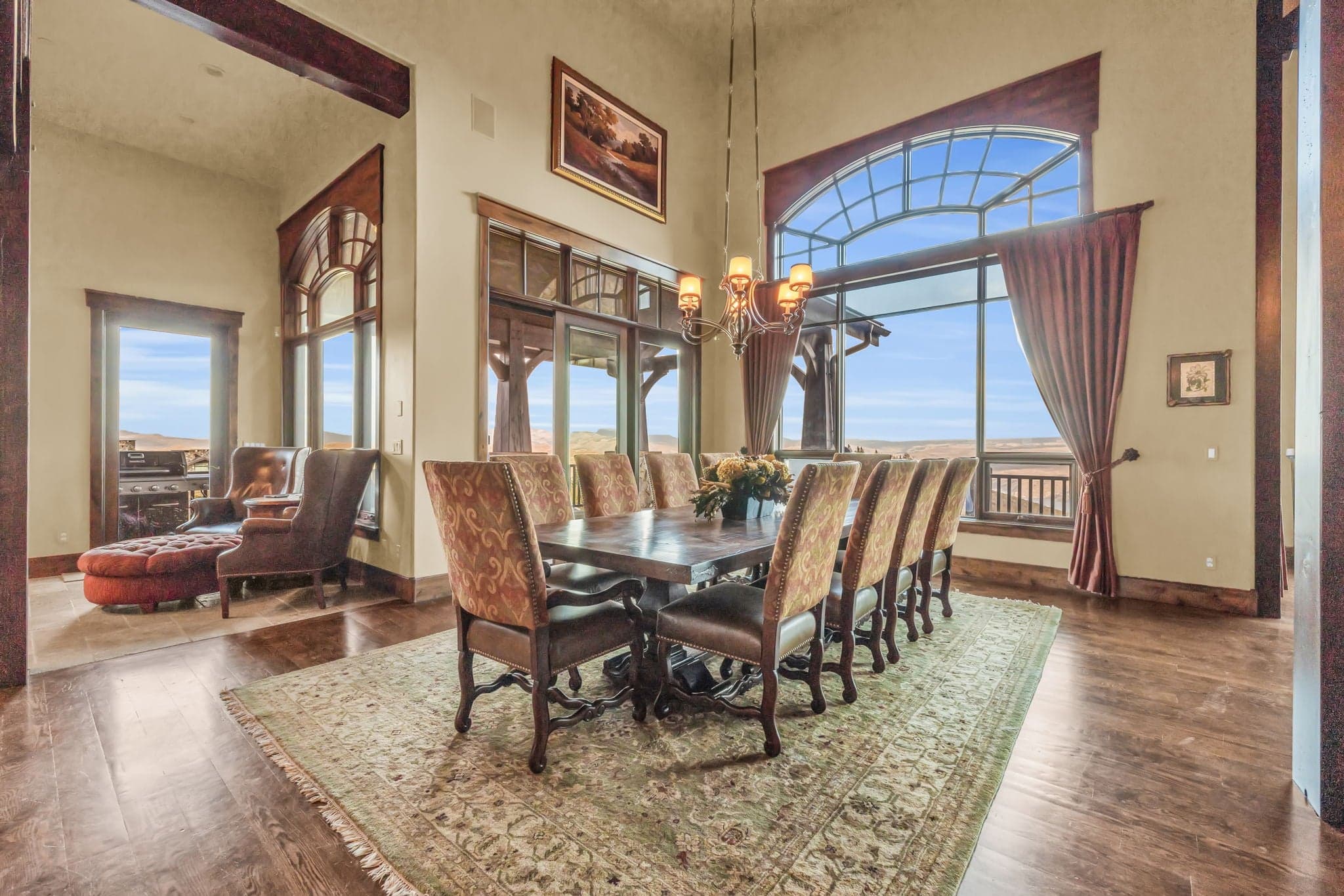 Morning Star dining room with chandelier, long table, and external views.