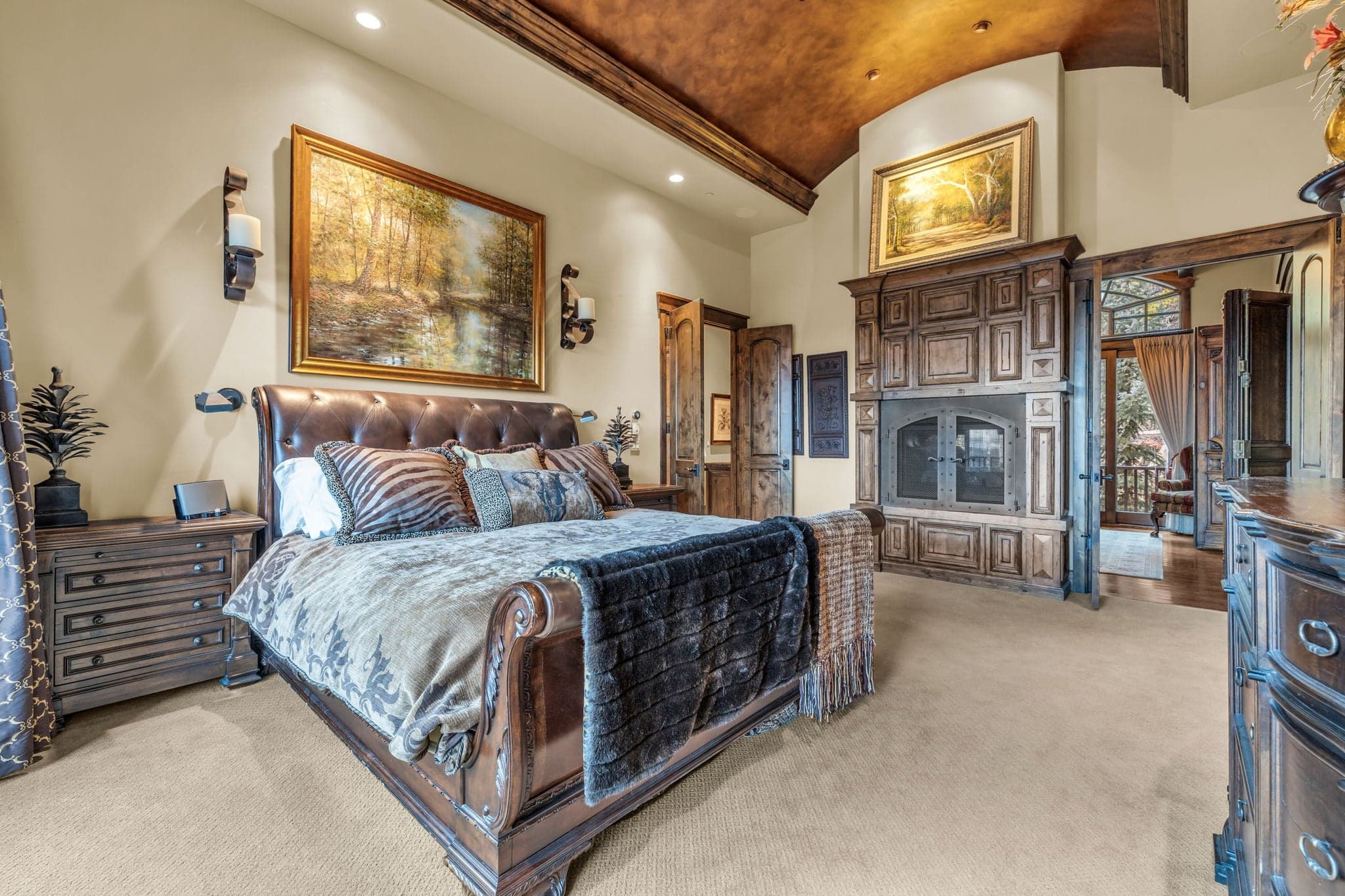 Beautiful Morning Star bedroom with Queen bed, wooden shelves, and paintings.