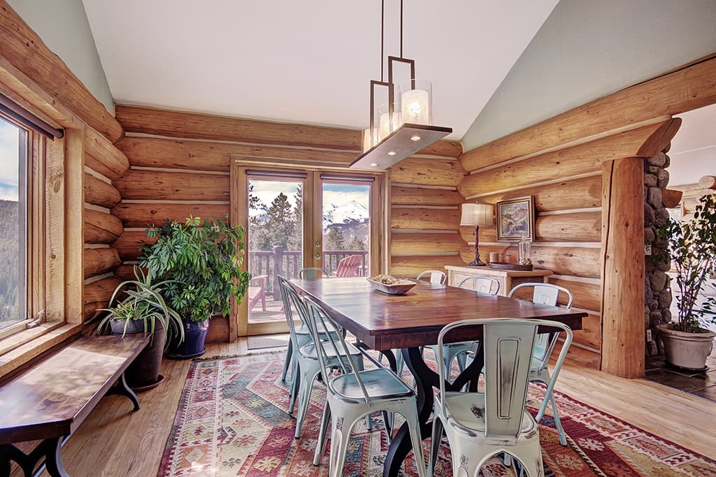 View from kitchen into dining area and deck access - 10 Southface - Breckenridge Vacation Rental