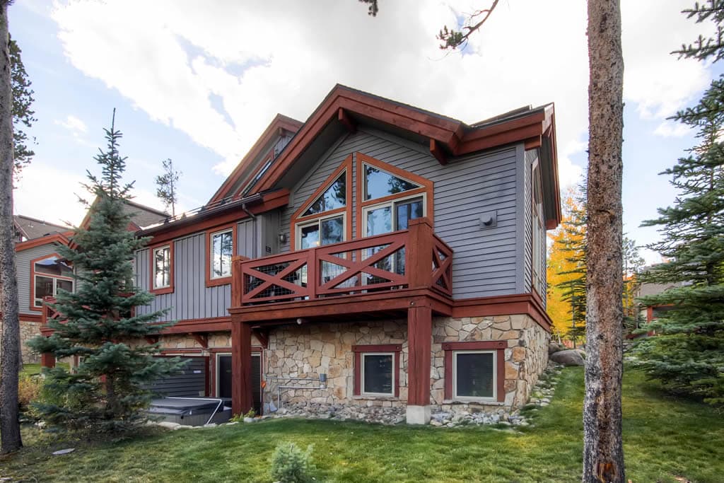 Backside exterior view of balcony and hot tub area - Amber Sky Breckenridge Vacation Rental