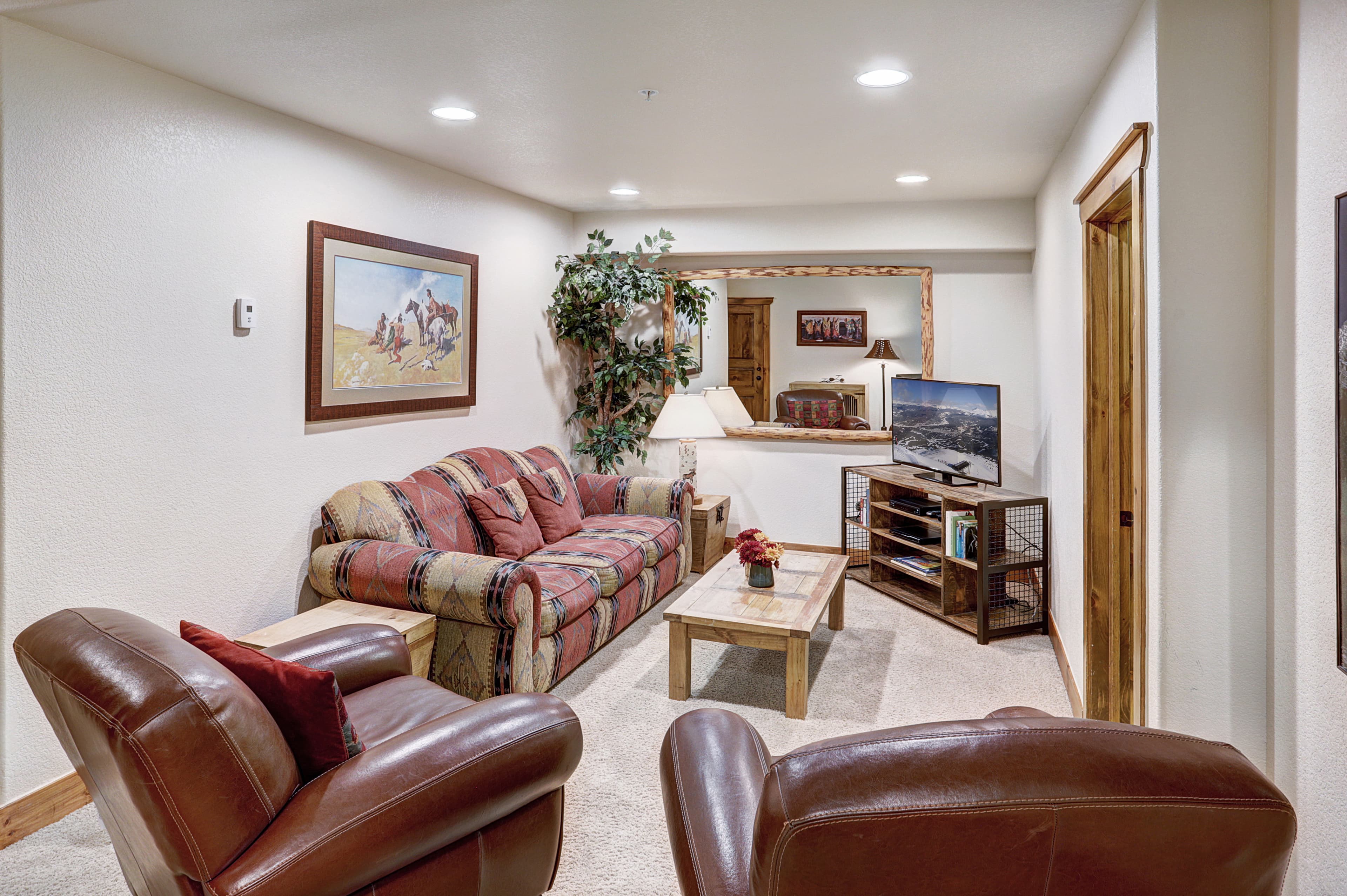 Watch a movie with friends and family in this lower level living space - Amber Sky Breckenridge Vacation Rental