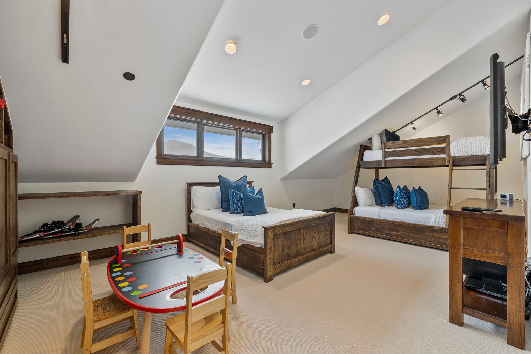 bunk suite with game table and 3 beds