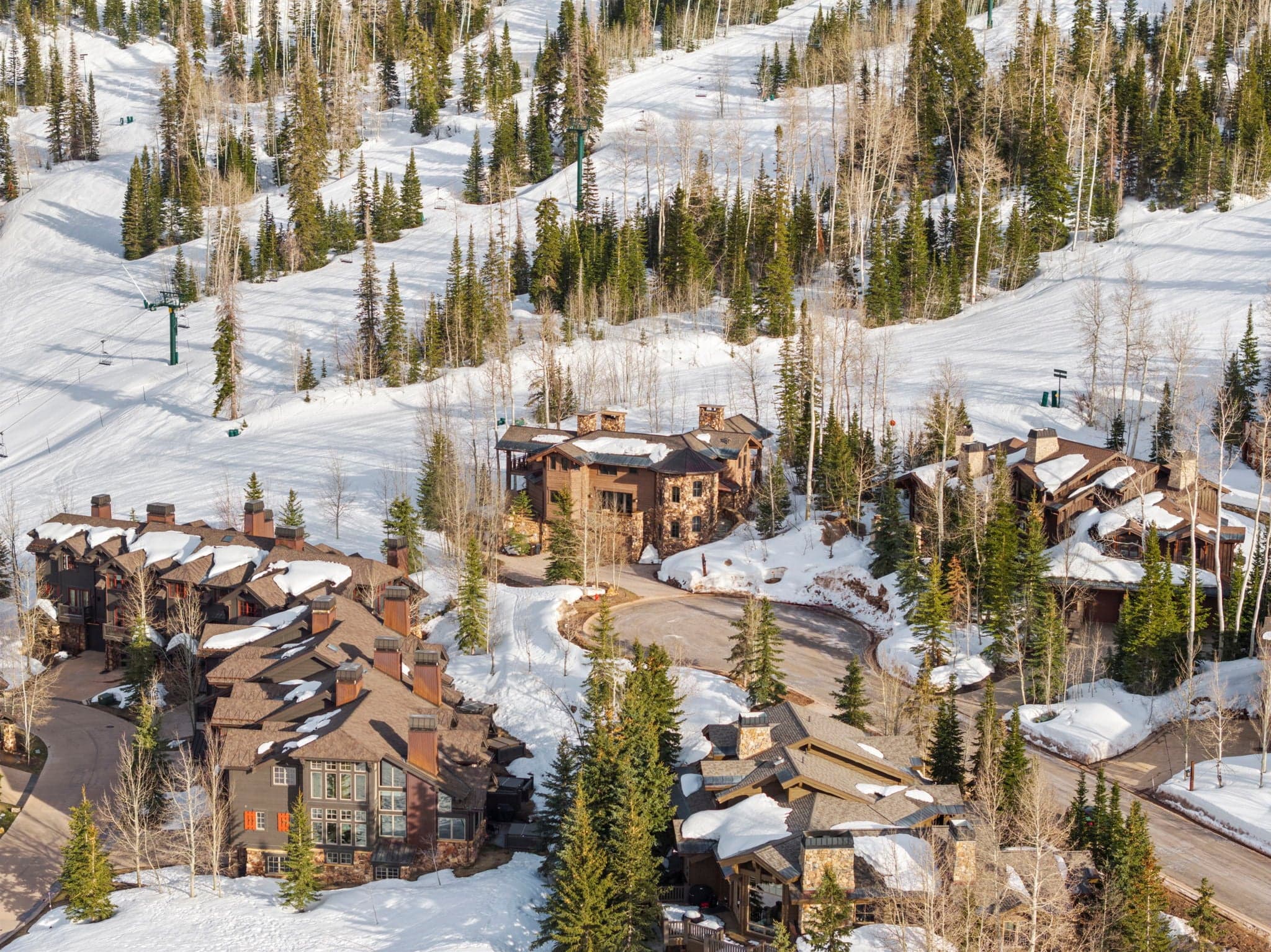 an areal view of Ski Utah Home with 3 different ski runs visible next to the home