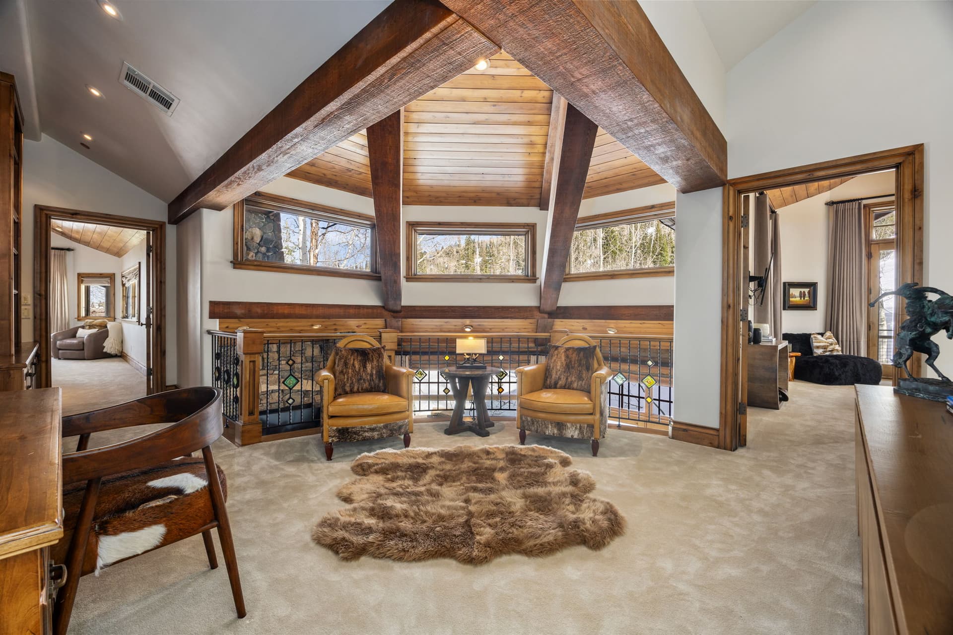 Upstairs seating area with large windows overlooking the mountains