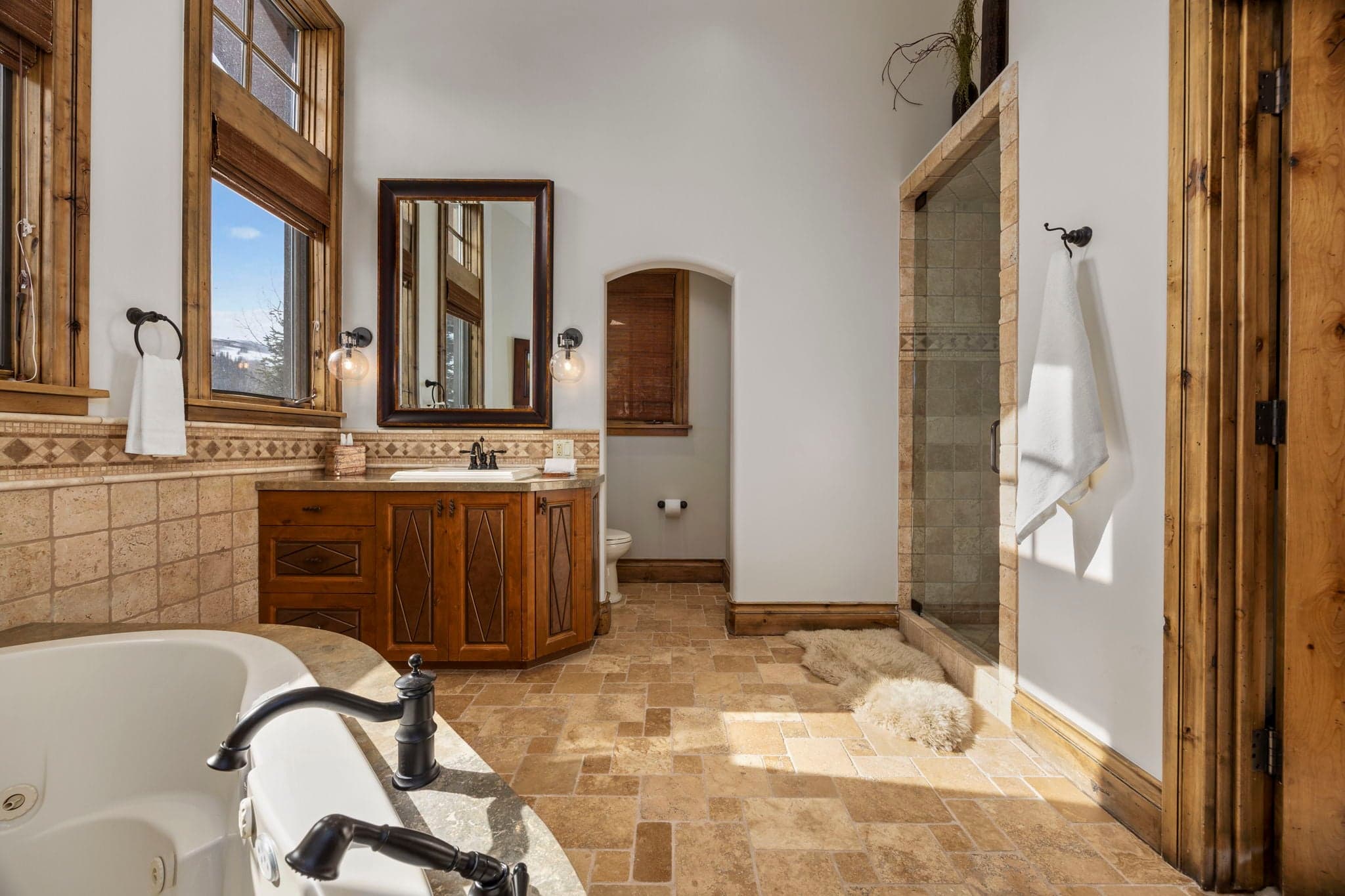 large ensuite bathroom for second primary with soaking tub and shower