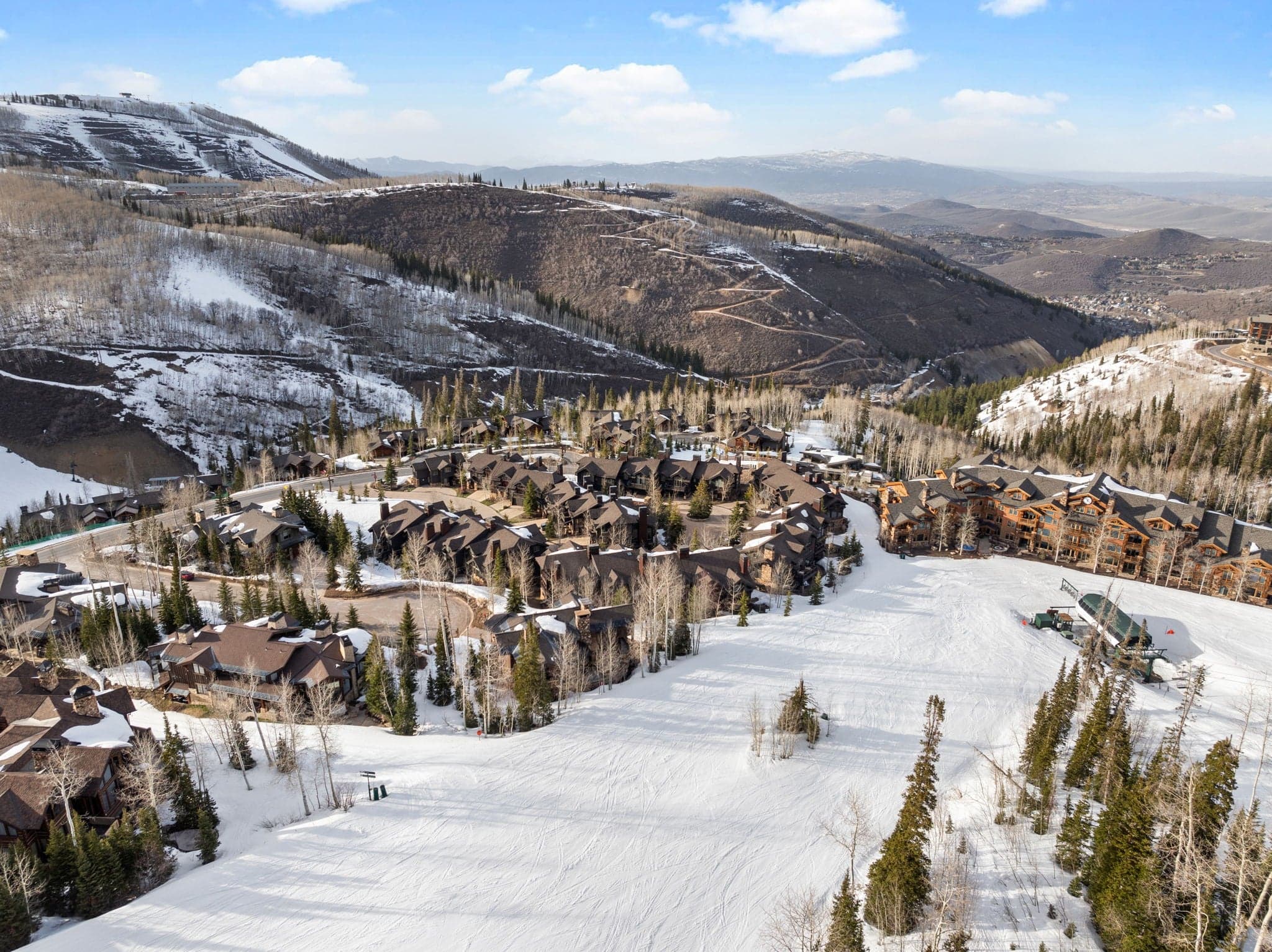 ski utah home location next to ski run and mountains in the background